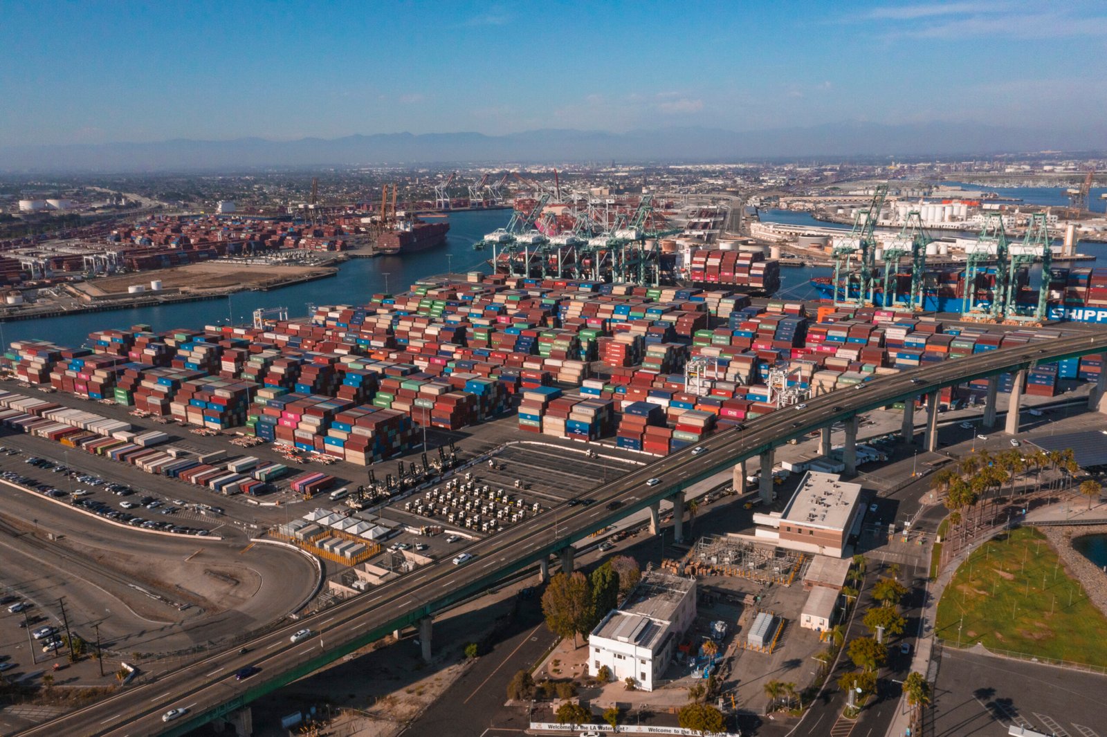 Port of San Pedro in Los Angeles CA with San Vicente Bridge in the Long Beach area with shipping containers stuck at harbor